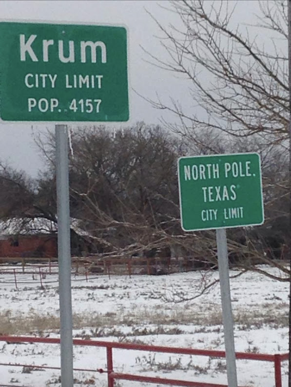 krum city limit north pole texas sign in the snow